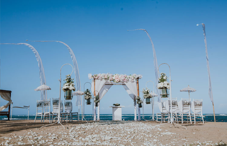 White sand ceremony beach wedding with the unobstructed beach as a background